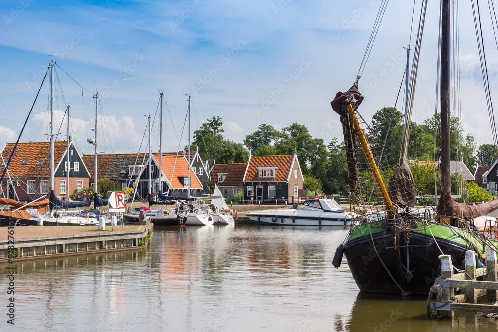 Traditional wooden sailing ship in the harbor of Marken, Netherlands