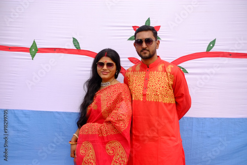 South asian young couple in traditional red costumes, festival costumes concept  photo