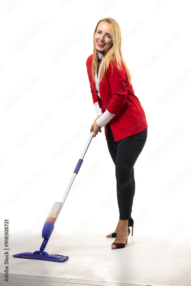 Business woman smiling while cleaning with a mop in a red blazer against a white background Business woman smiling while cleaning with a mop in a red blazer against a white background