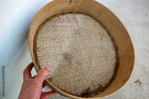 A fine-mesh sieve made of leather, used in Turkey in the past to sift grain.