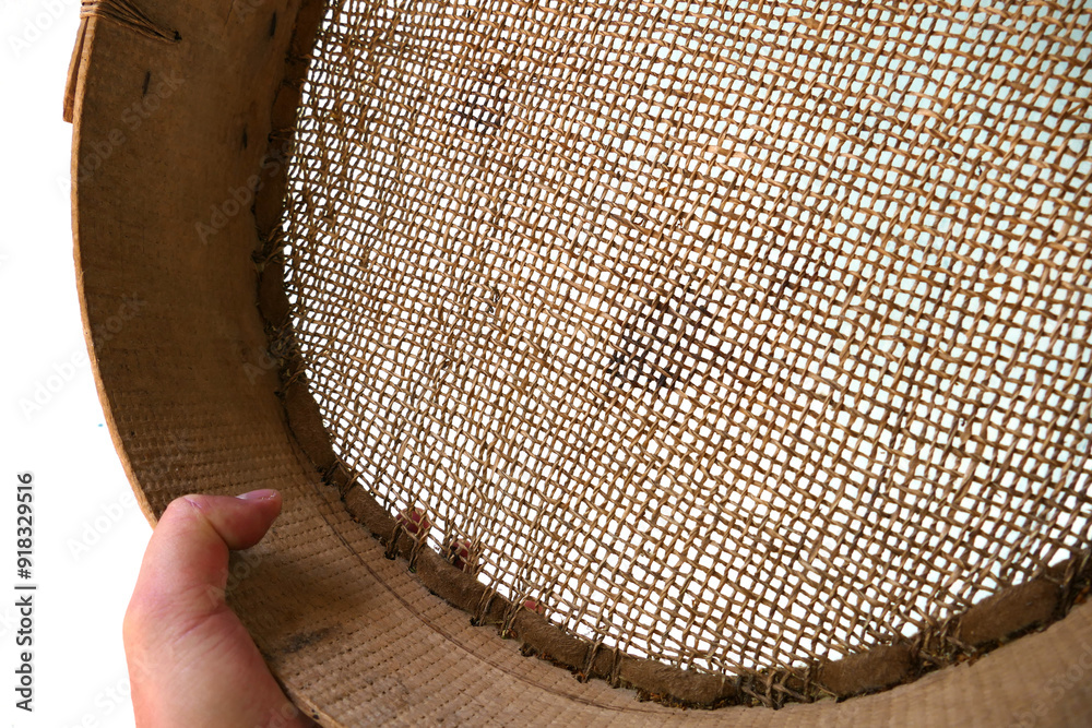 a fine-mesh sieve made of leather for sifting grain,