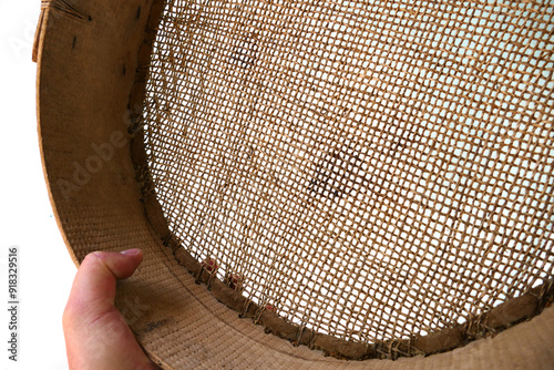 Obraz na płótnie a fine-mesh sieve made of leather for sifting grain, w salonie