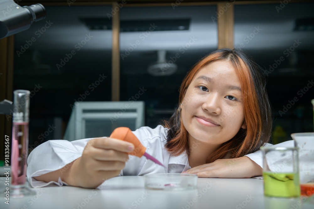 girl scientist using Dropper with Rubber Test. education and science girl scientist using Dropper with Rubber Test. education and science