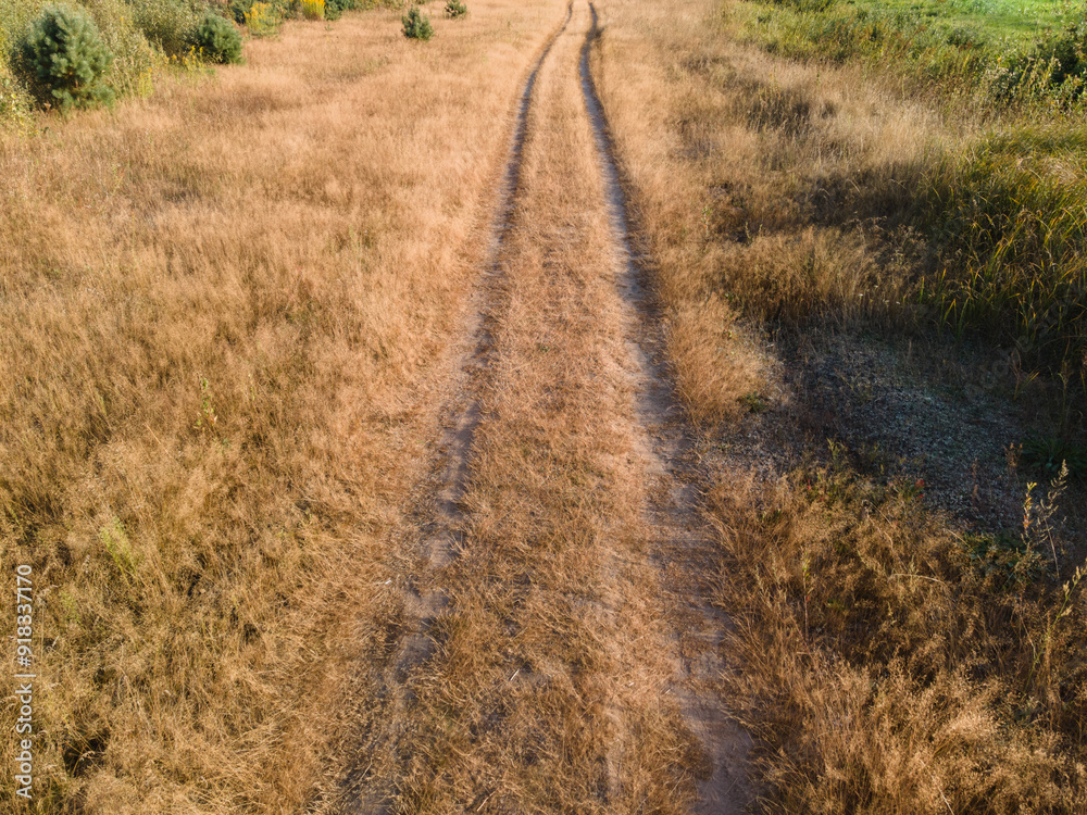 Fototapeta premium View of the roads, landscape and fields from the height of a flying drone. 
