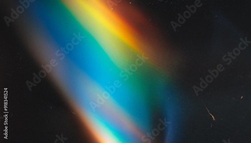 Abstract Light Refraction on Black Background. Spectrum of Rainbow Colors Blurred by Lens Flare, Featuring Vibrant Red, Orange, Green, and Blue Hues in a Soft, Ethereal Glow