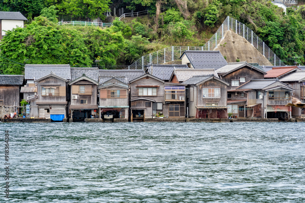 Beautiful scenic view with the wooden traditional waterfront boat houses called funaya around Ine Bay, in the village Ine, Japan Beautiful scenic view with the wooden traditional waterfront boat houses called funaya around Ine Bay, in the village Ine, Japan