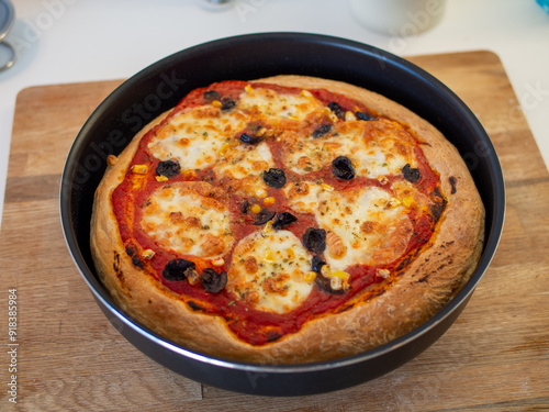 Fresh, hot, oven-baked Italian Neapolitan pizza with mozzarella cheese