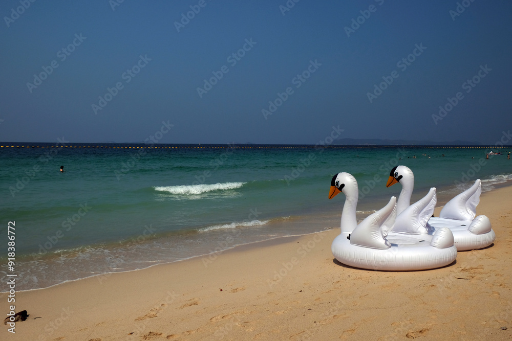 inflatable ring in the form of a swan on the beach, Thailand inflatable ring in the form of a swan on the beach, Thailand