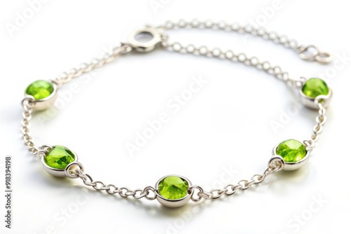 Vibrant green peridot gemstones adorn a delicate silver chain bracelet, symbolizing compassion, emotional balance, and joy, perfect for August birthdays or as a thoughtful gift.