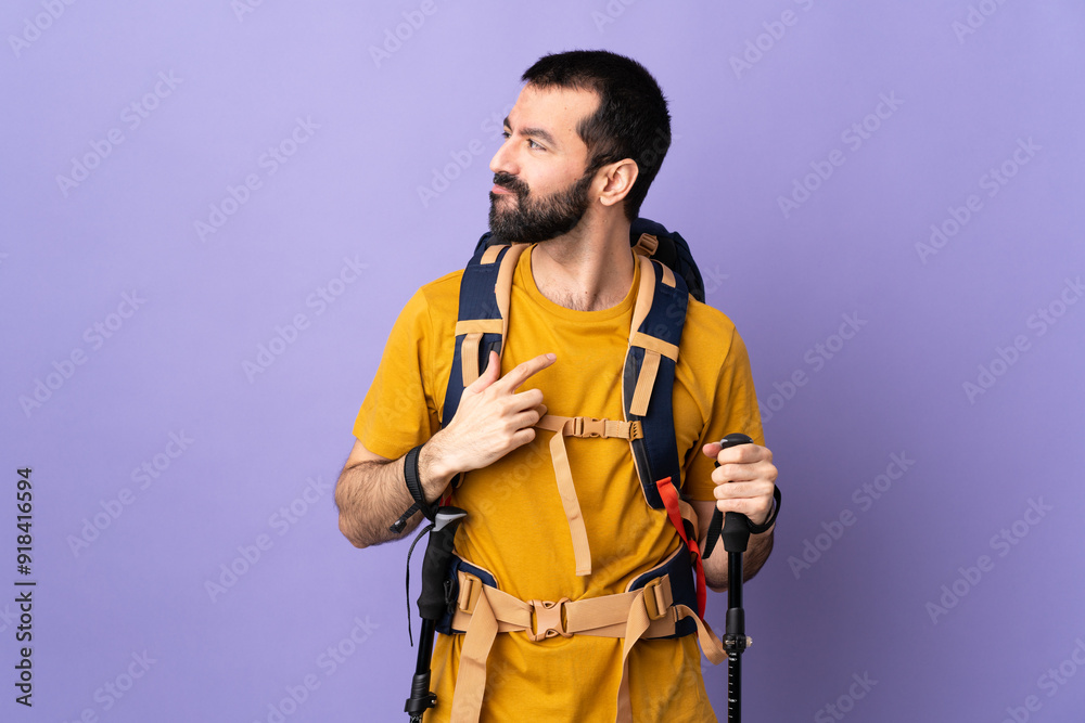 Caucasian handsome man with backpack and trekking poles over isolated background having doubts while looking side Caucasian handsome man with backpack and trekking poles over isolated background having doubts while looking side