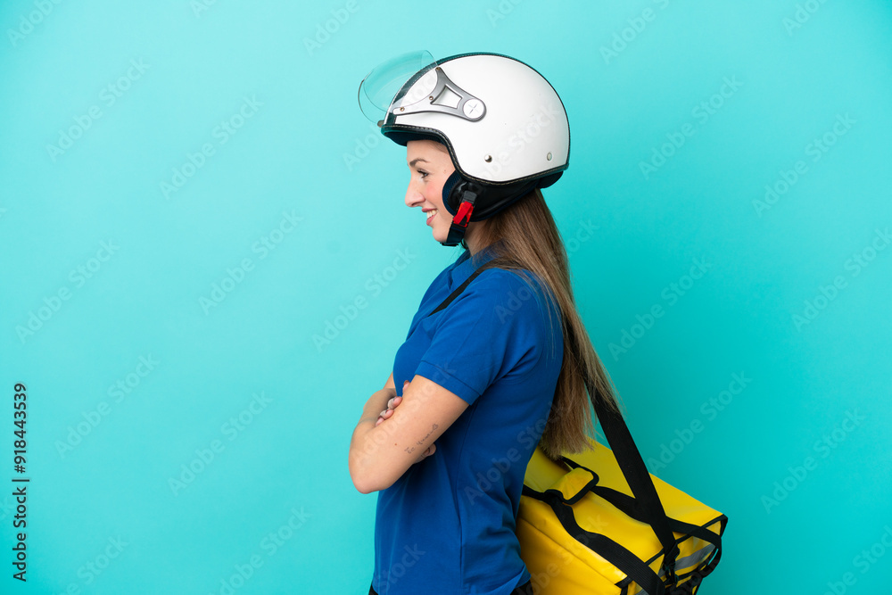Young caucasian woman with thermal backpack isolated on white background in lateral position Young caucasian woman with thermal backpack isolated on white background in lateral position