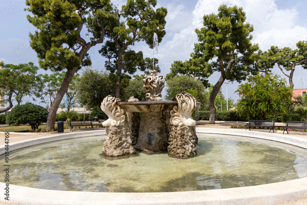 City Park and fountain with octopuses, located at Largo Fontanelle street, Monopoli, Italy, Apulia