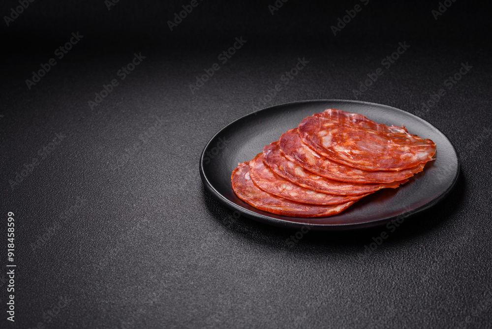 Delicious smoked meat sliced with salt, spices and herbs Delicious smoked meat sliced with salt, spices and herbs