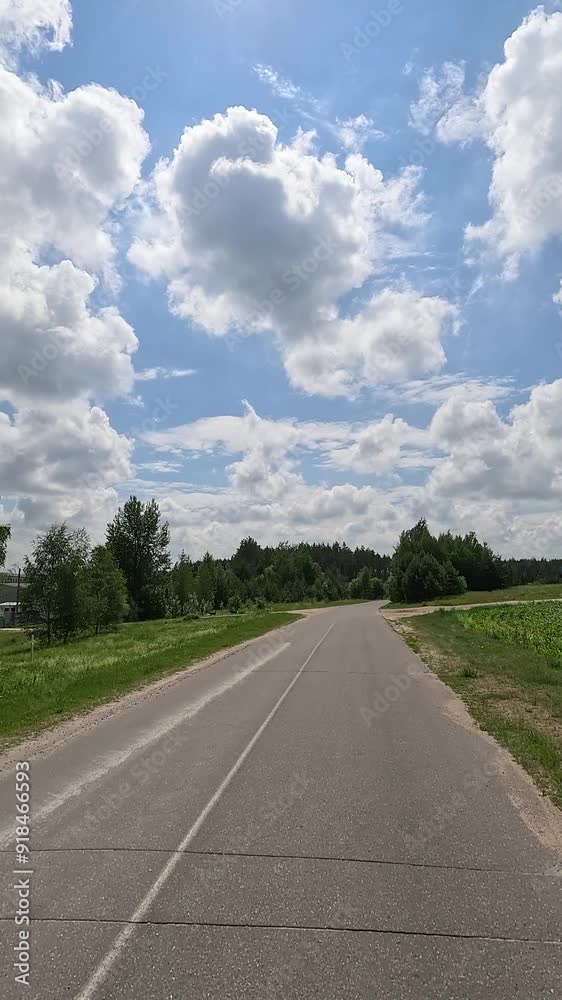 The car drives along the road on a summer day. Highways, roadside and road line markings. The car drives along the road on a summer day. Highways, roadside and road line markings.