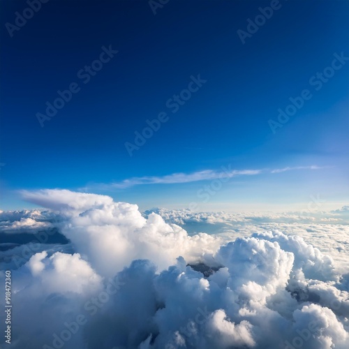 Sun rays shinning in the blue sky with layer of clouds viewed from above.