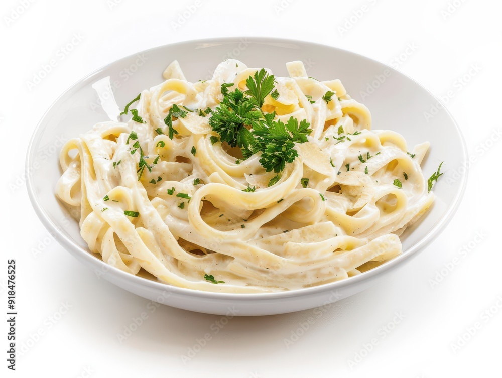 Creamy pasta in a white bowl on a plain background Creamy pasta in a white bowl on a plain background