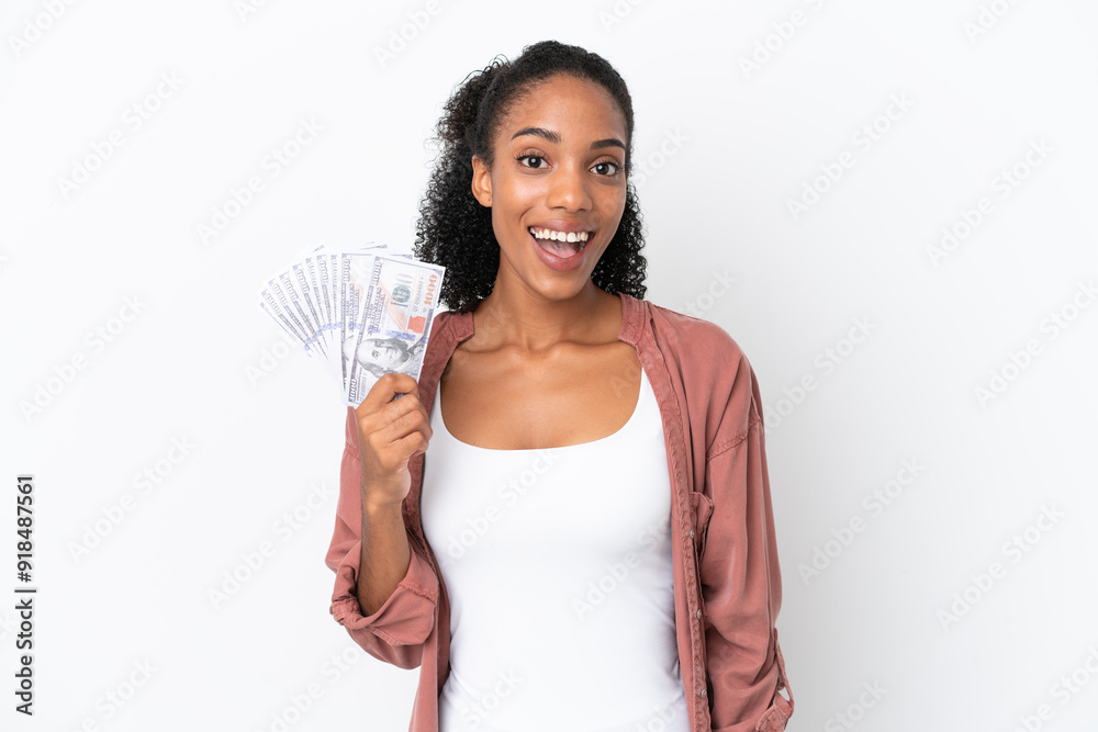 Young African American woman taking a lot of money isolated on white background with surprise facial expression Young African American woman taking a lot of money isolated on white background with surprise facial expression