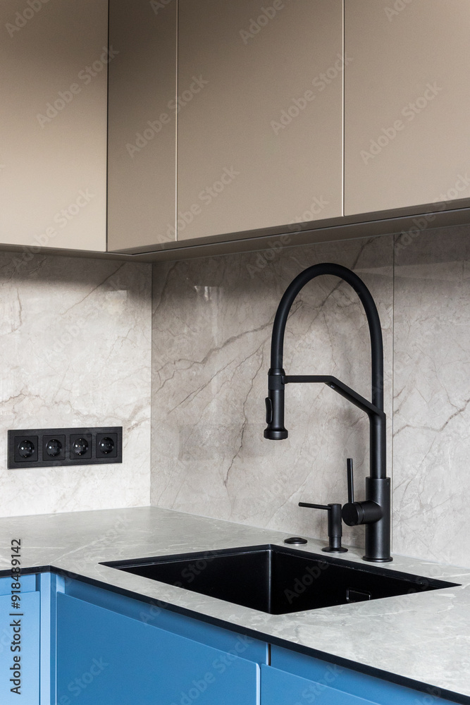 kitchen faucet on a stylish metal sink kitchen faucet on a stylish metal sink