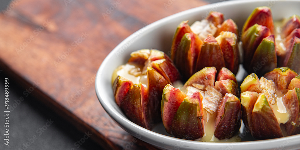 figs baked with cheese camembert or brie fresh meal food snack on the table copy space food background rustic top view keto or paleo diet vegetarian vegan food figs baked with cheese camembert or brie fresh meal food snack on the table copy space food background rustic top view keto or paleo diet vegetarian vegan food
