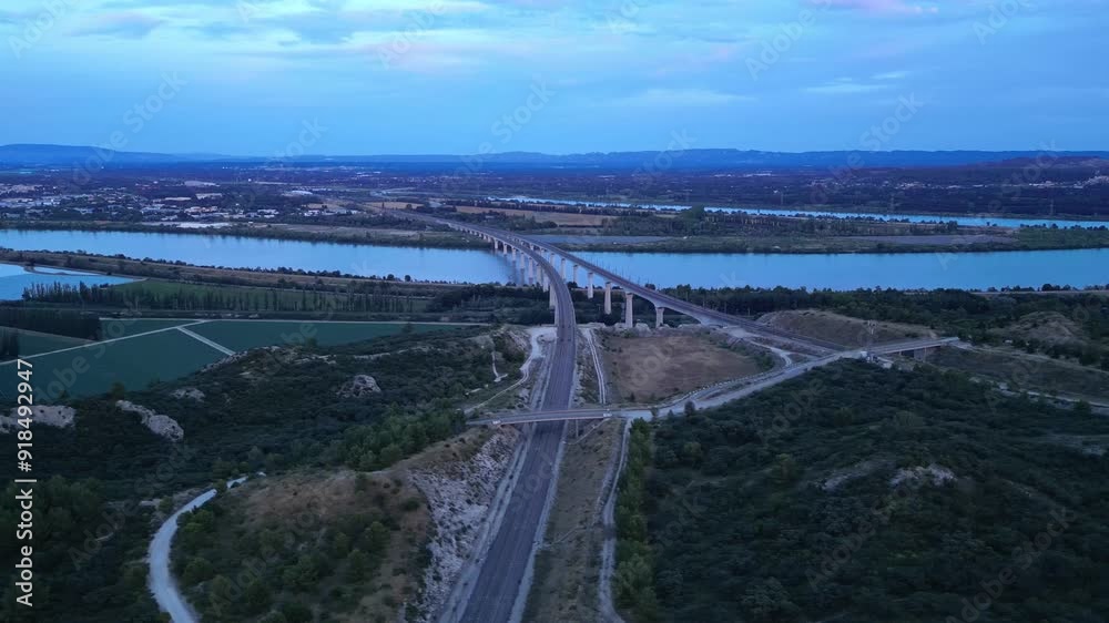 Panoramic aerial view of the double viaduct for high-speed passenger trains over the Rhône river in Avignon during sunset - France Panoramic aerial view of the double viaduct for high-speed passenger trains over the Rhône river in Avignon during sunset - France