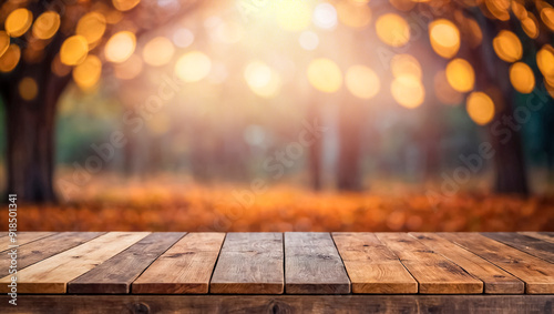 Empty wooden table on defocused autumn nature background. Photo with copy space