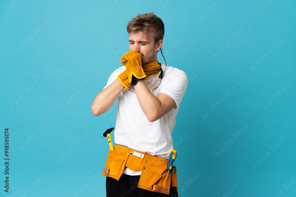 Young electrician man over isolated wall is suffering with cough and feeling bad Young electrician man over isolated wall is suffering with cough and feeling bad