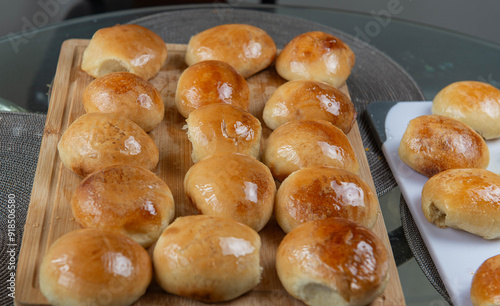 Freshly baked burger buns close up. Freshly baked buns home baking. Handmade.