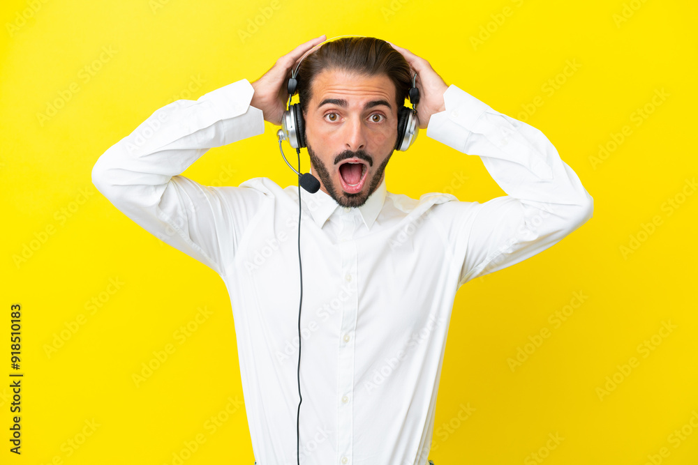 Telemarketer caucasian man working with a headset isolated on yellow background with surprise expression Telemarketer caucasian man working with a headset isolated on yellow background with surprise expression