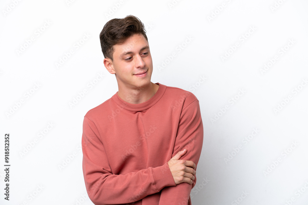 Young handsome Brazilian man isolated on white background laughing