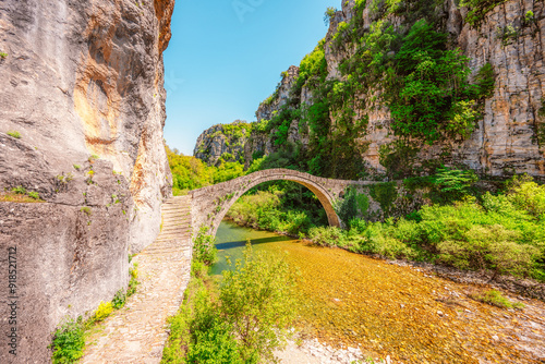 Kokkorou bridge, medieval stone bridge on river of Voidomatis, Pindus Mountains, Zagori, Greece. photo