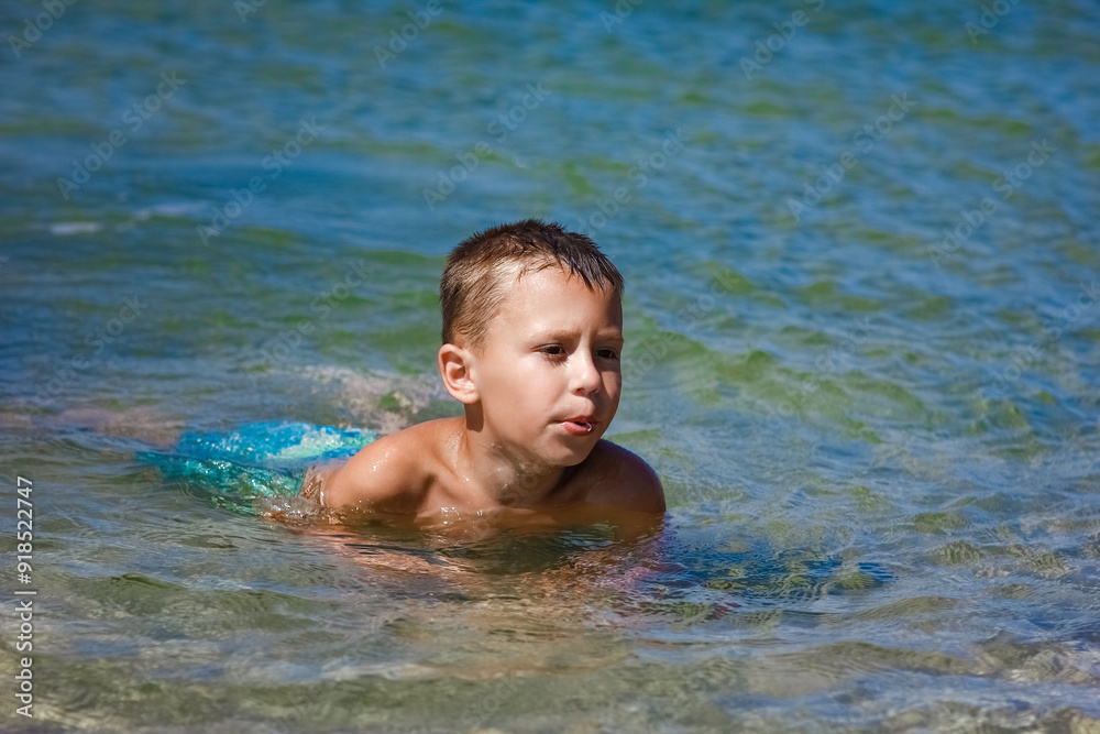 A Happy child playing in the sea swim in nature A Happy child playing in the sea swim in nature