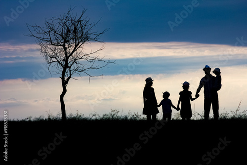 A Happy family silhouette on nature in park background