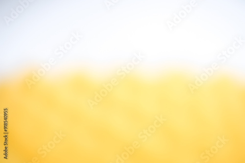 White and orange blurred background image for text