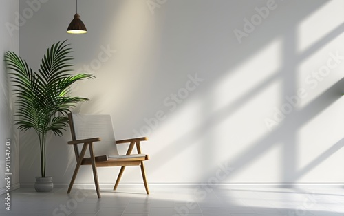 A white chair is sitting in front of a potted plant. The room is empty and has a minimalist design