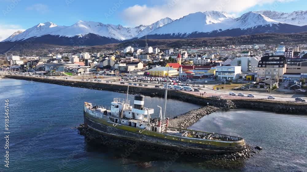 Saint Christopher Boat At Ushuaia Tierra Del Fuego Argentina. Birds Eye View Of Stunning Cityscape With Streets And Buildings. Nature Tourism Icon Snow Covered Forest Trees. Saint Christopher Boat At Ushuaia Tierra Del Fuego Argentina. Birds Eye View Of Stunning Cityscape With Streets And Buildings. Nature Tourism Icon Snow Covered Forest Trees.