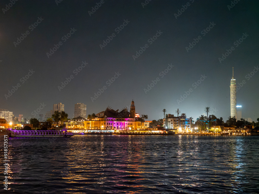 Night view of the city of Cairo form a boat on the Nile River , Egypt