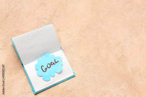 Open notebook with a blue s...