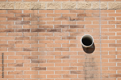 Tube in Brick Wall