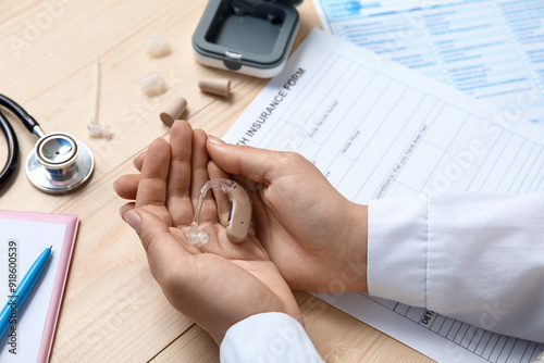 Hands of female doctor with...
