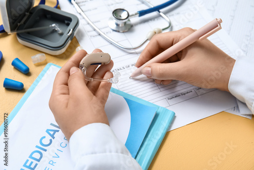 Female doctor with hearing ...