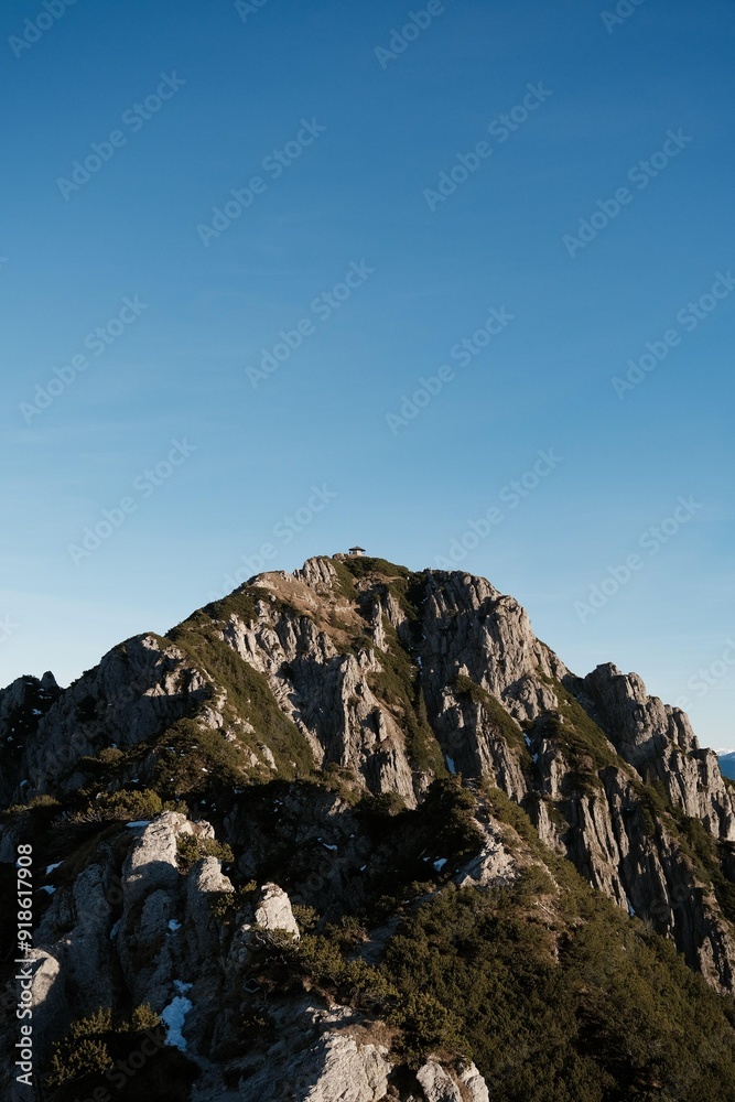 Majestic Rocky Mountain Peak Under Clear Blue Sky (Herzogstand, Germany) Majestic Rocky Mountain Peak Under Clear Blue Sky (Herzogstand, Germany)