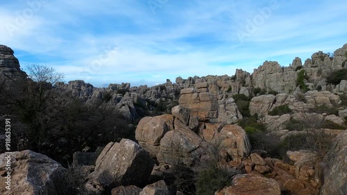 Hiking in the Torcal de Antequerra National Park, limestone rock formations and known for unusual karst landforms in Andalusia, Malaga, Spain. photo