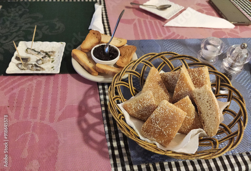 Moroccan breakfast ftour, msemen, baghrir, orange juice, pastries, bread basket, fried eggs, cheese cubes, cake slices, butter, table setup morning meal traditional dishes photo