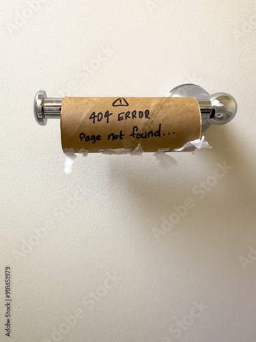 An empty toilet roll with a 404 not found error on it