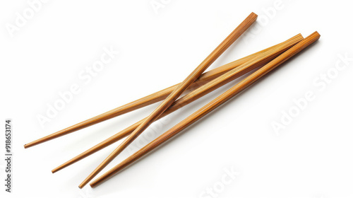 Set of elegant wooden chopsticks cut out on a clean white background.