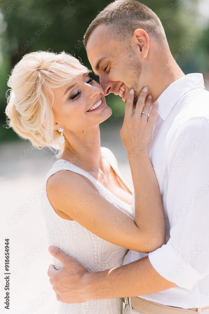 Romantic Couple Embracing Outdoors on a Sunny Day in White Attire Romantic Couple Embracing Outdoors on a Sunny Day in White Attire