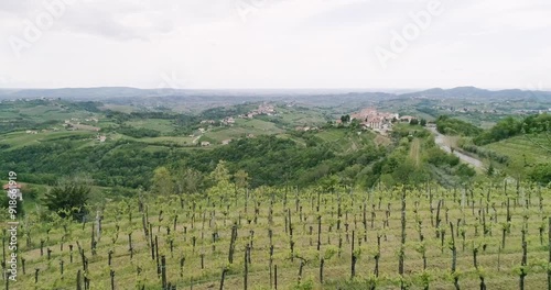 Aerial drone view pan of the Collio hills, Cormons, Nova Gorica near Gorizia. European Capital of Culture 2025. Typical local products vineyards and wines. Gonjače Tower places to visit and tradition.