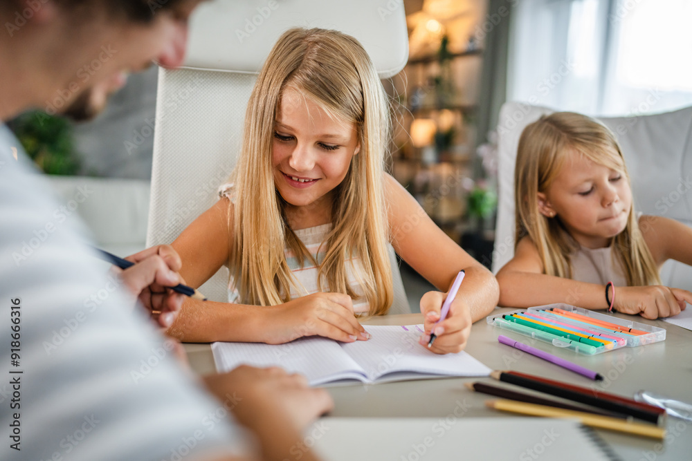 two young girl child write homework at home two young girl child write homework at home