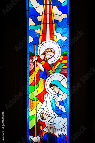 Stained glass decorations depicting stories about Jesus and stories from the Bible inside the Cathedral in Dili City, Timor Leste.