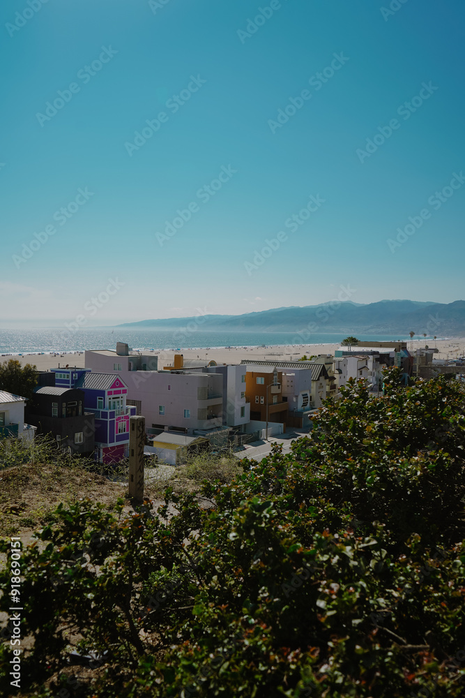 City with beach and mountains in background City with beach and mountains in background